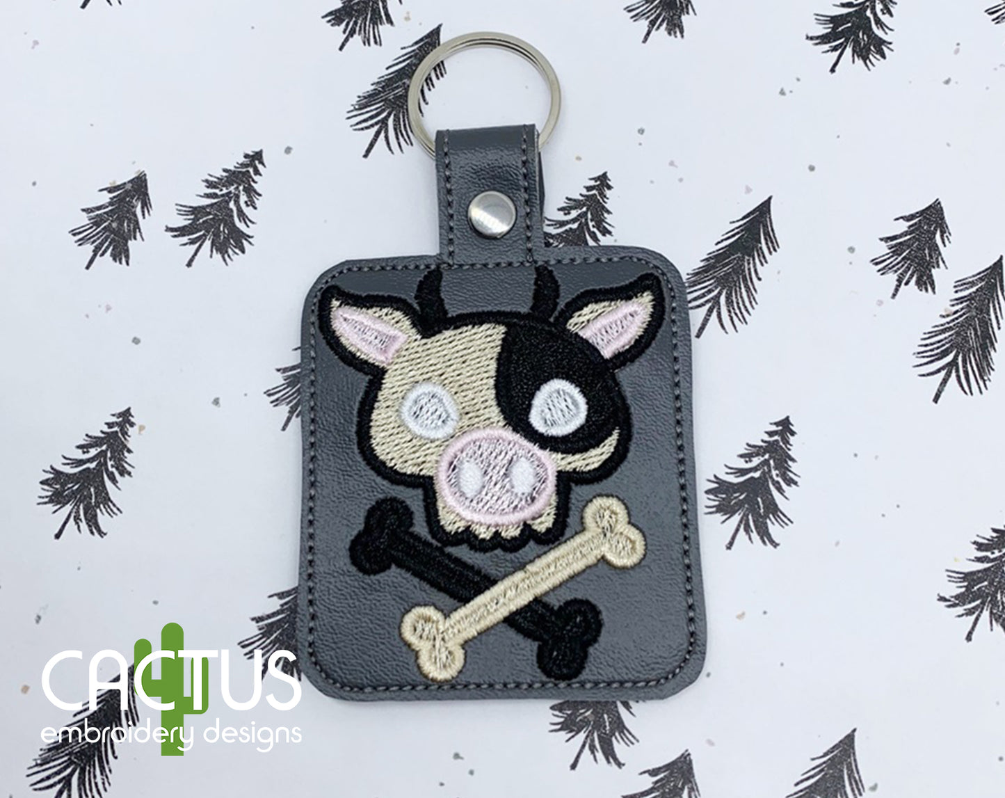 Cow Crossbones Snap Tab & Eyelet Fob