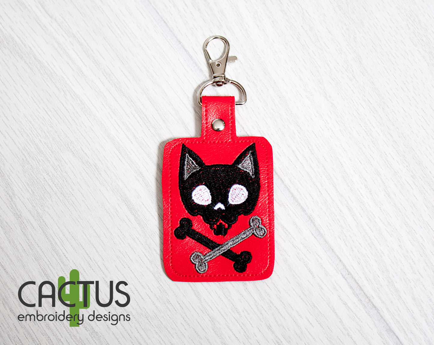 Kitten Crossbones Snap Tab & Eyelet Fob