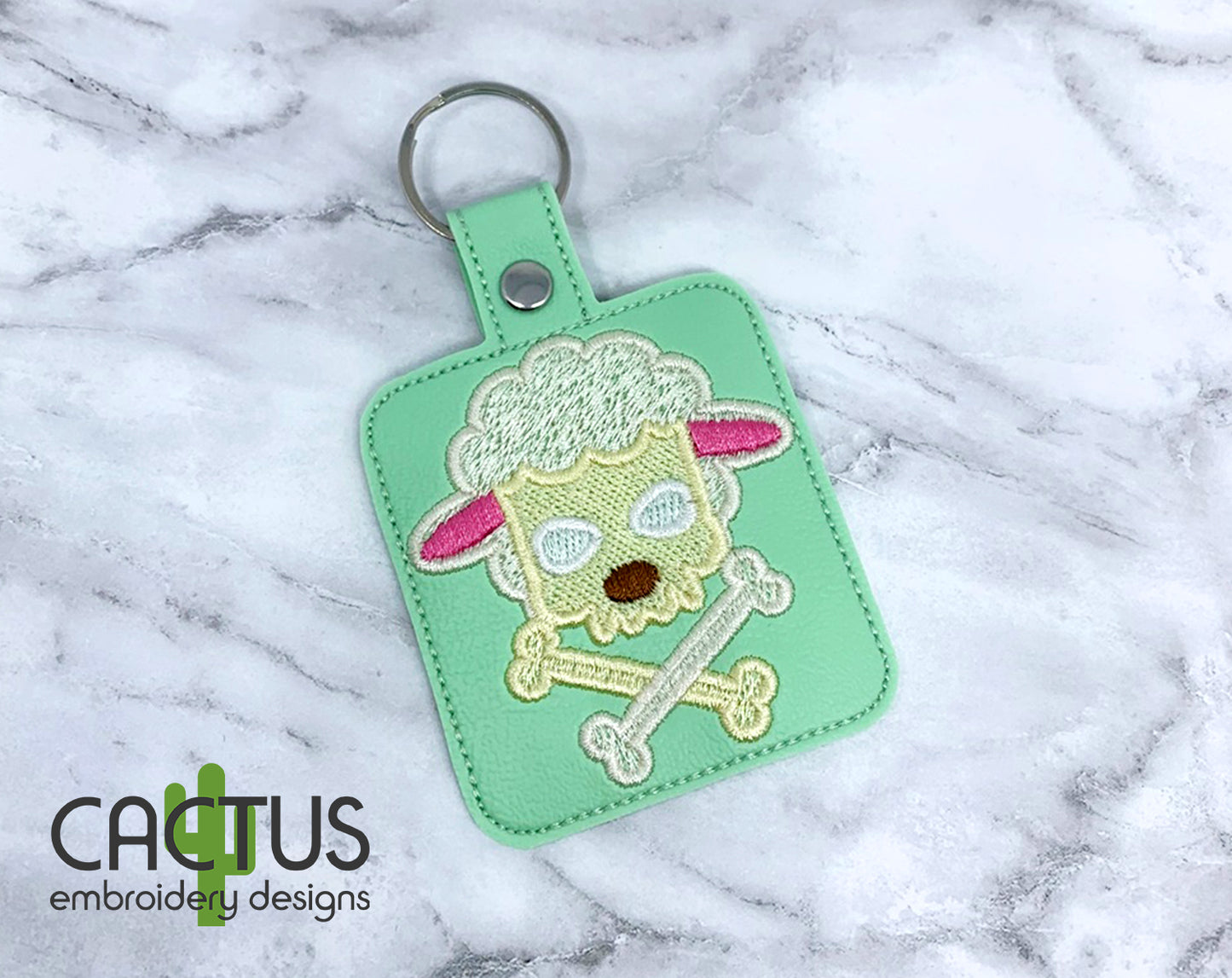 Lamb Crossbones Snap Tab & Eyelet Fob