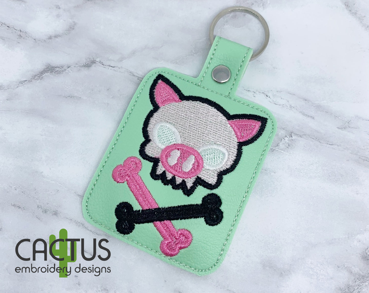 Piggy Crossbones Snap Tab & Eyelet Fob