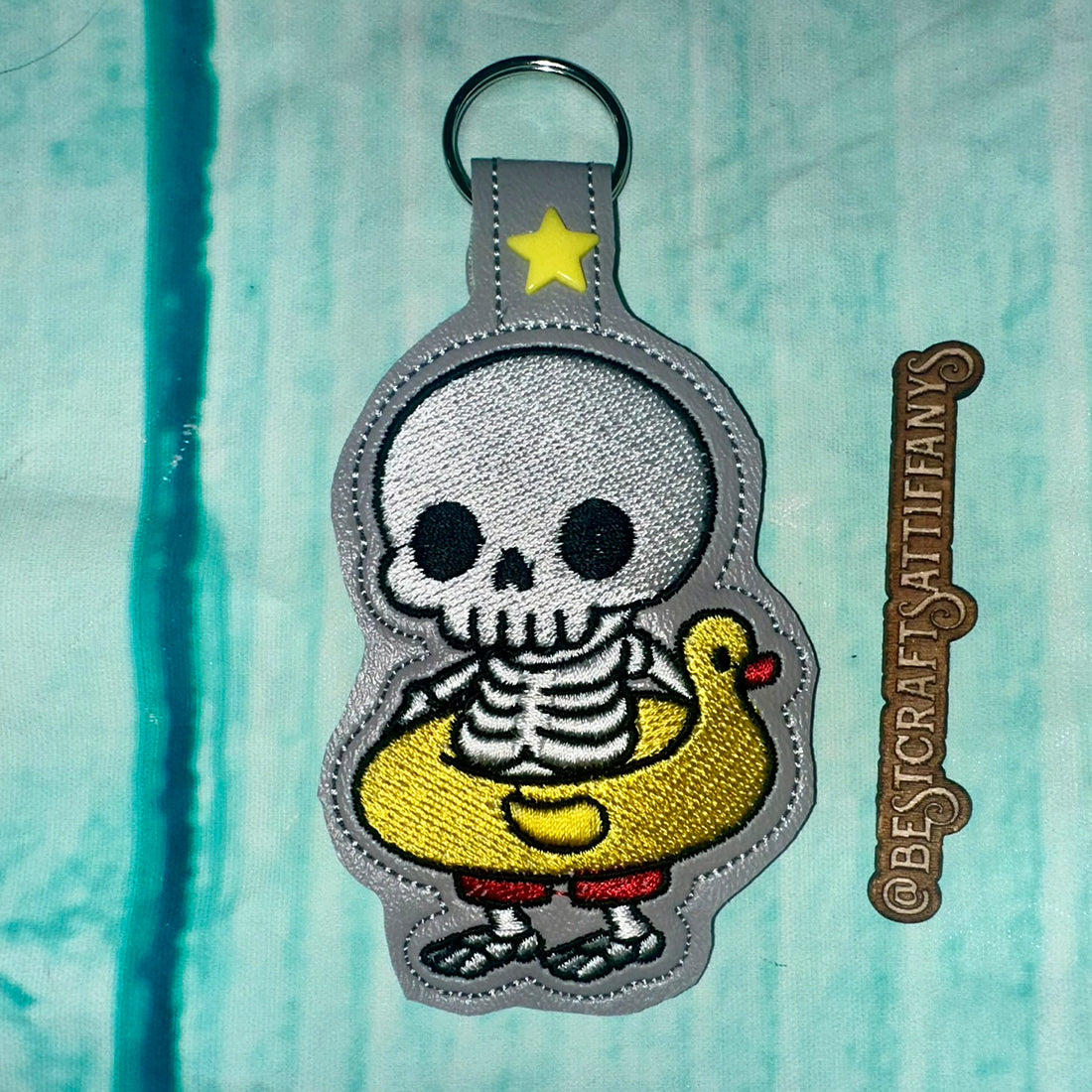 Skeleton in a duck lifebuoy Snap Tab & Eyelet Fob