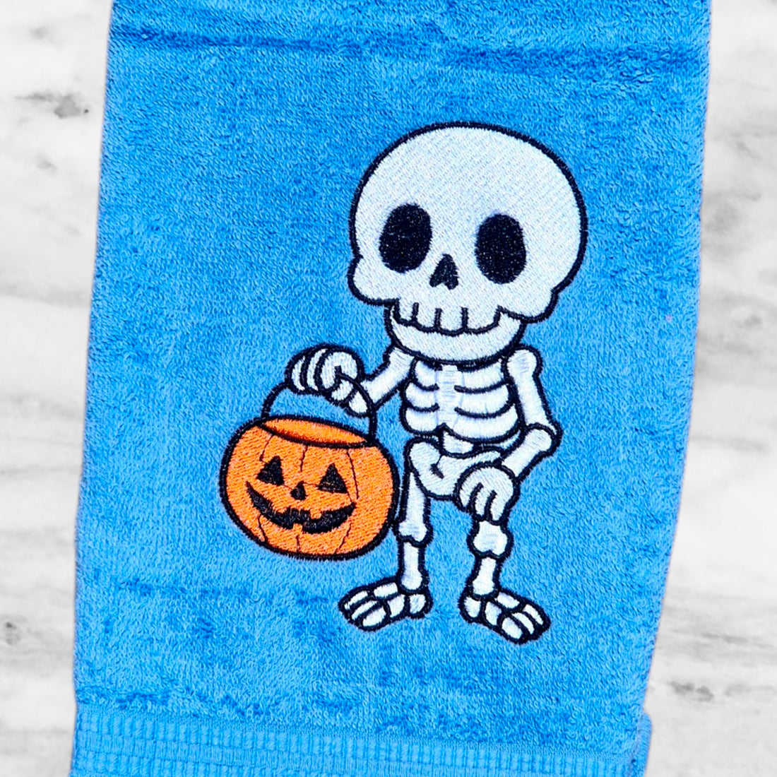 Skeleton with a Halloween Bucket Embroidery Design
