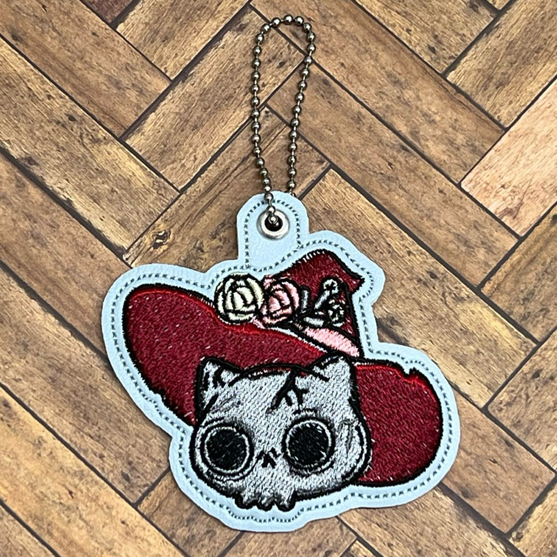 SkullCat in a Hat Snap Tab & Eyelet Fob