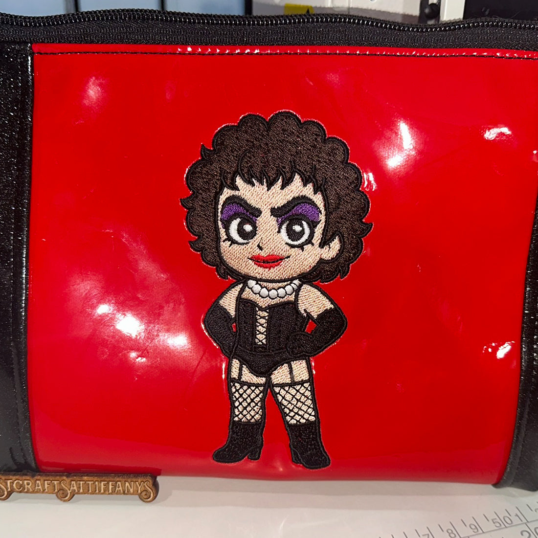 Glam rock stockings patch embroidery design, cabaret-style figure in fishnet stockings and wig