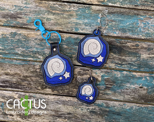 Fossil Set of Eyelet Fob, Snap Tab & Zipper Pull