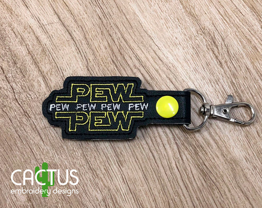 Pew Pew Snap Tab & Eyelet Fob