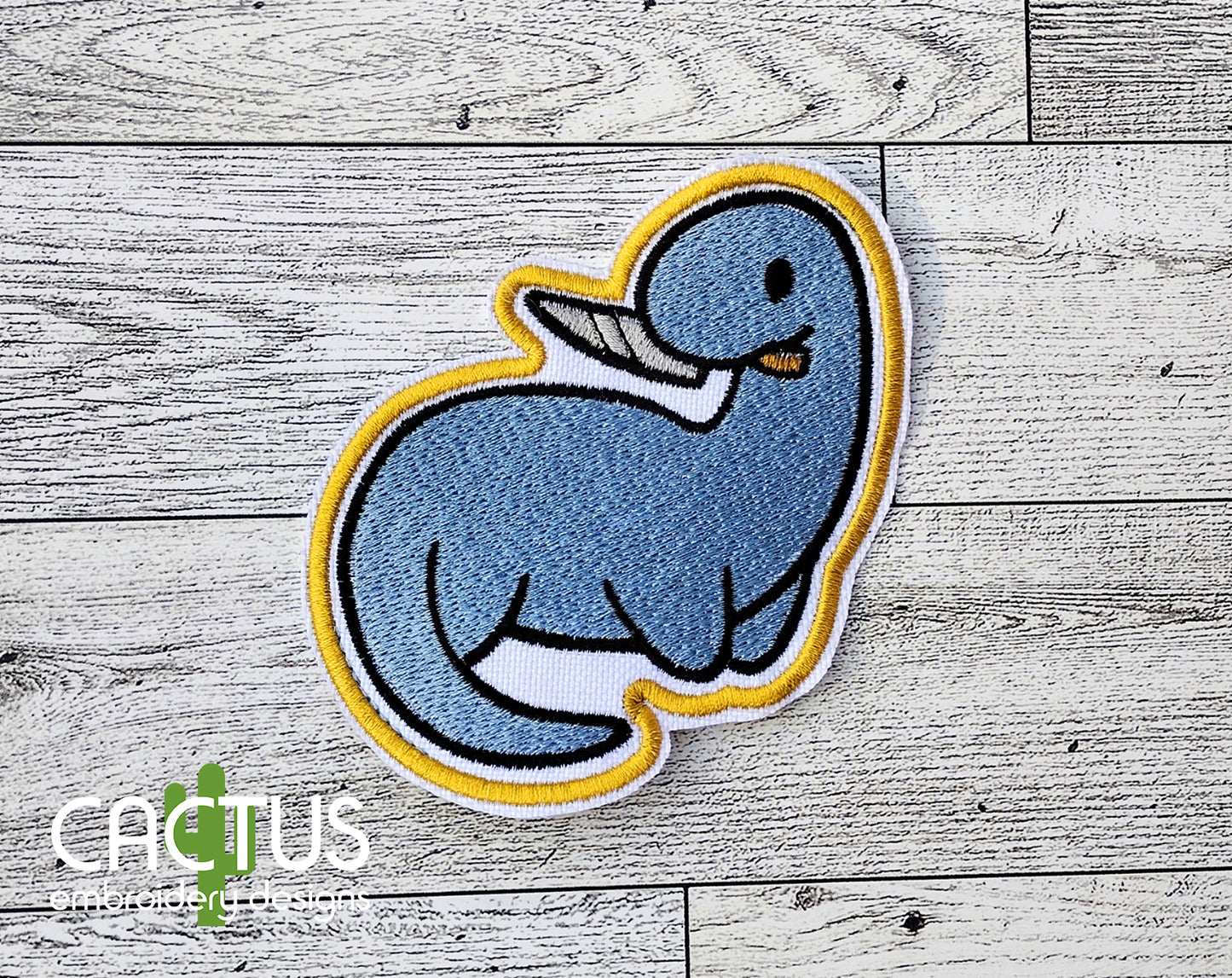 Dino with a Knife Patch Embroidery Design