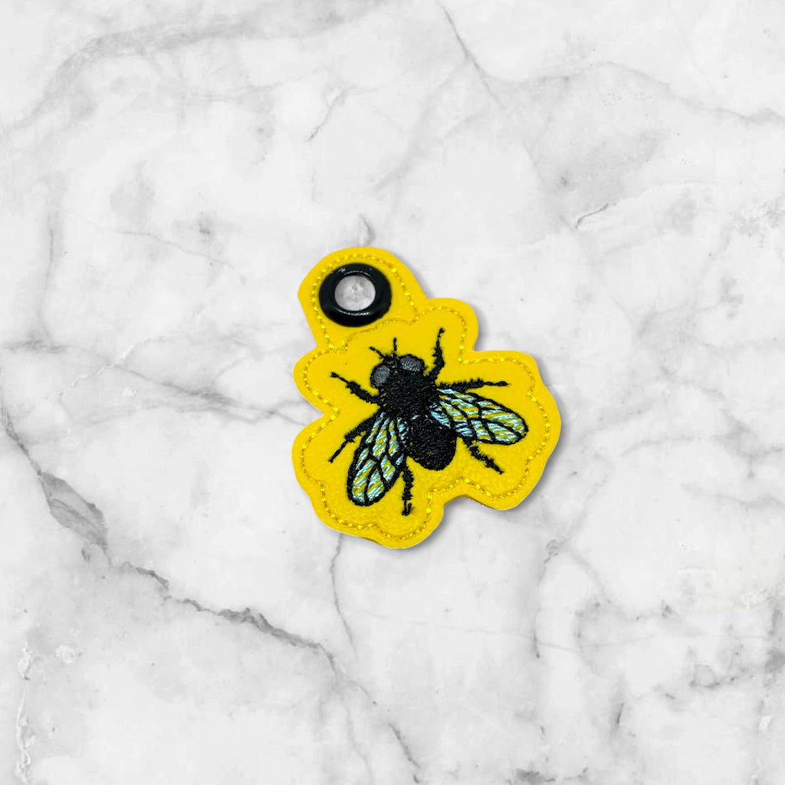 Fly Eyelet Fob