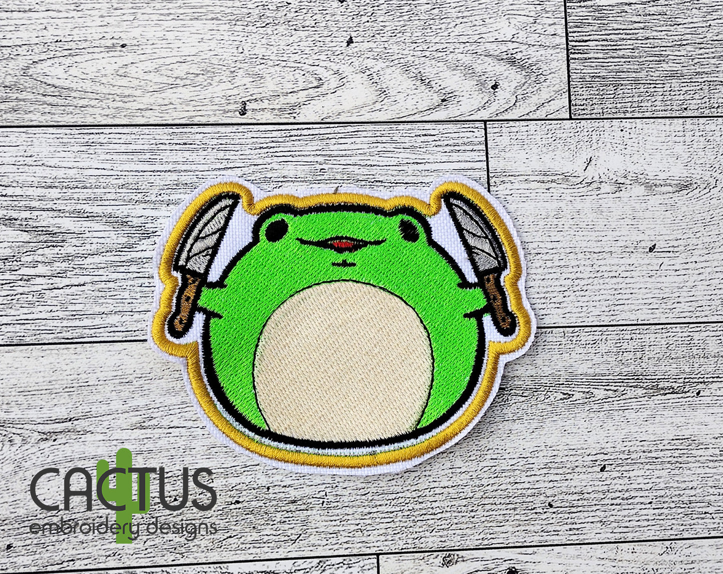 Froge with a Knife Patch Embroidery Design