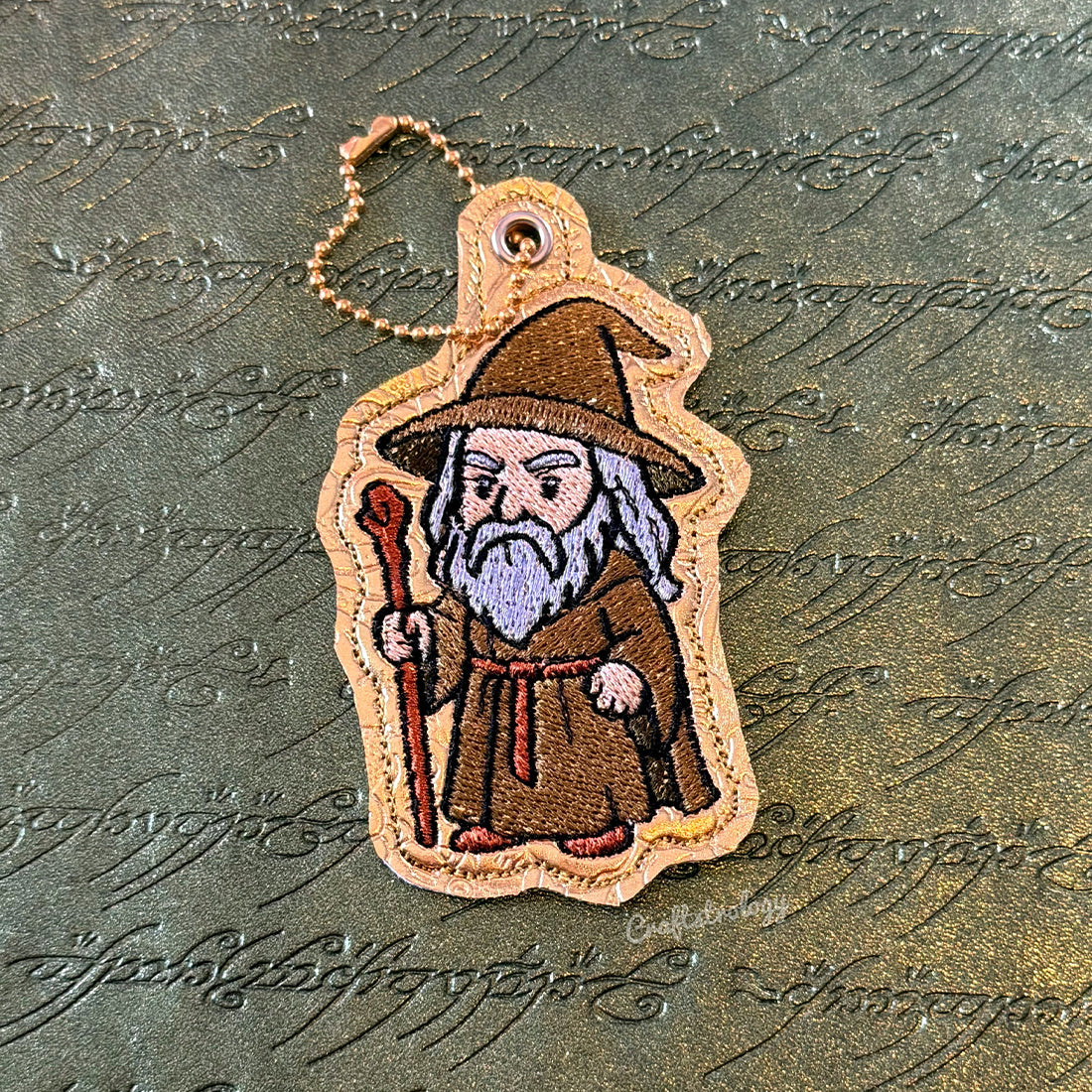 The Grey Wanderer Snap Tab & Eyelet Fob