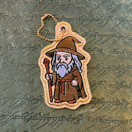 The Grey Wanderer Snap Tab & Eyelet Fob