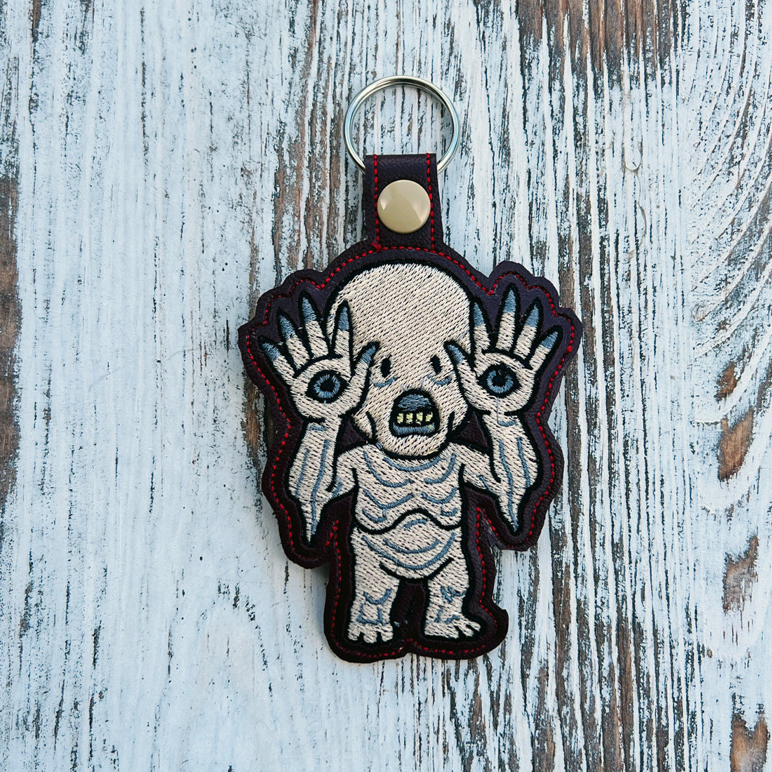Pale Man Snap Tab & Eyelet Fob