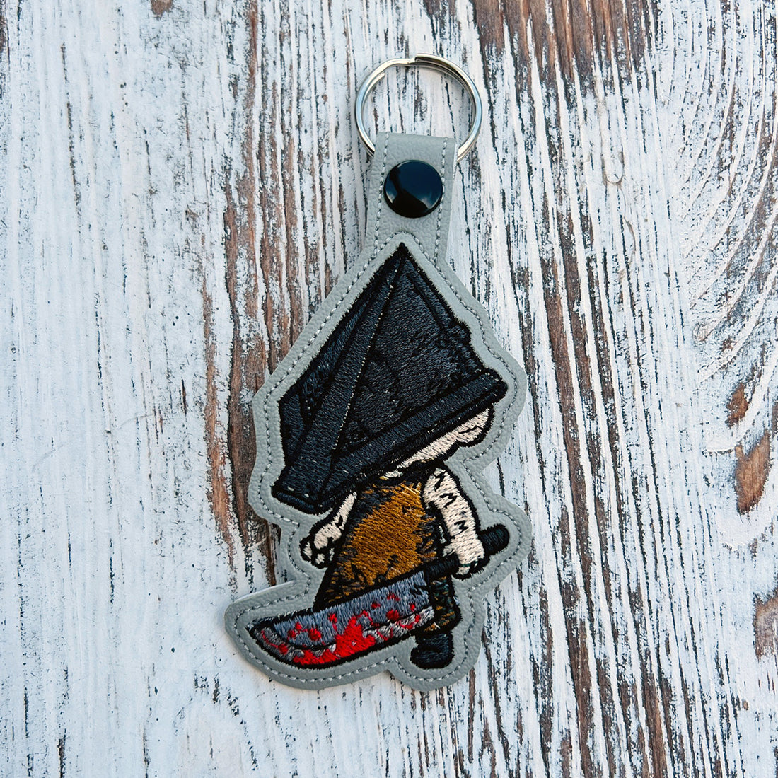 Pyramidhead Snap Tab & Eyelet Fob