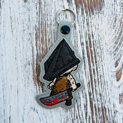 Pyramidhead Snap Tab & Eyelet Fob