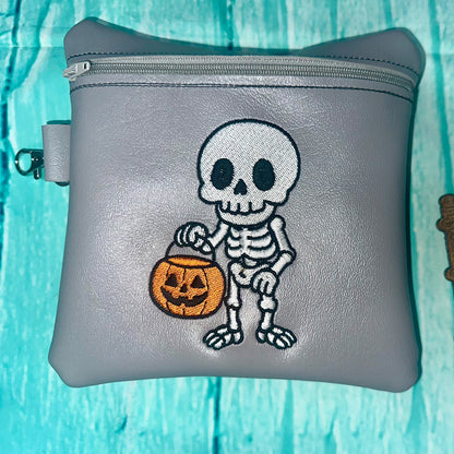 Skeleton with a Halloween Bucket Embroidery Design