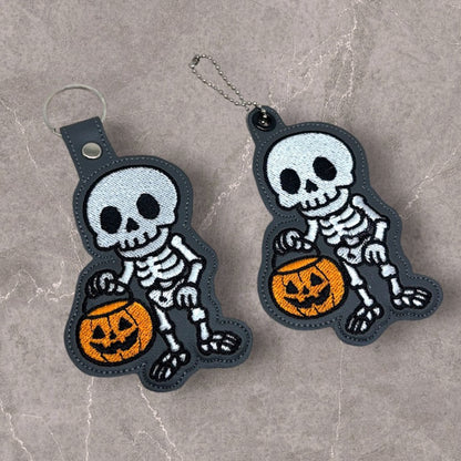 Skeleton with a Halloween Bucket Snap Tab & Eyelet Fob