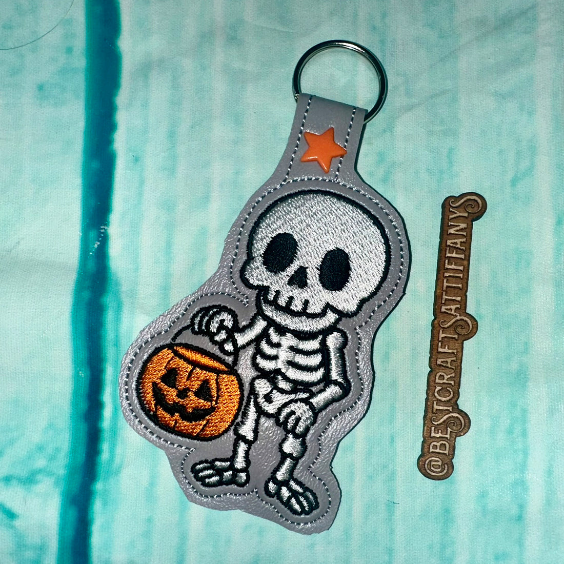 Skeleton with a Halloween Bucket Snap Tab & Eyelet Fob