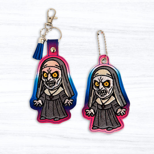The Nun Snap Tab & Eyelet Fob