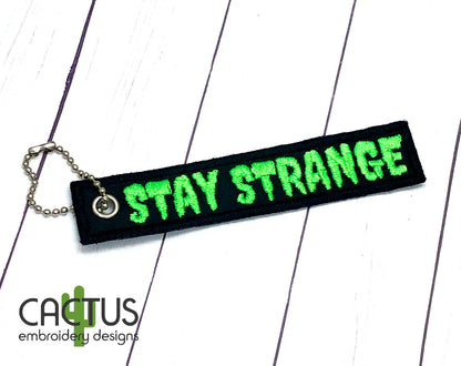 Stay Strange Patch & Eyelet Fob Embroidery Design