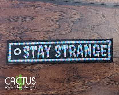 Stay Strange Patch & Eyelet Fob Embroidery Design
